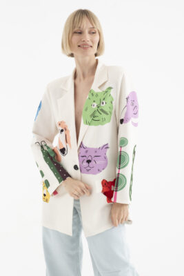 “Female model in purple blazer sitting pose – NYC e-commerce fashion photography for online retail.”