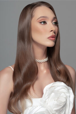 Professional portrait of a woman with long hair in a white dress — personal branding photography