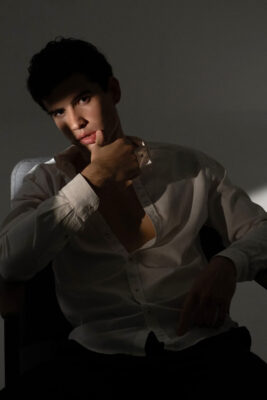 Editorial personal branding portrait of a man in studio lighting