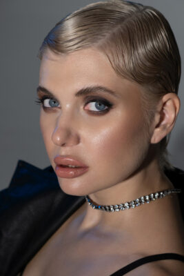 Beauty-style personal branding portrait of a woman with slicked-back hair