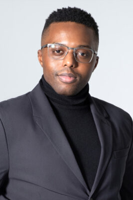 Modern personal branding portrait of a man wearing a black blazer