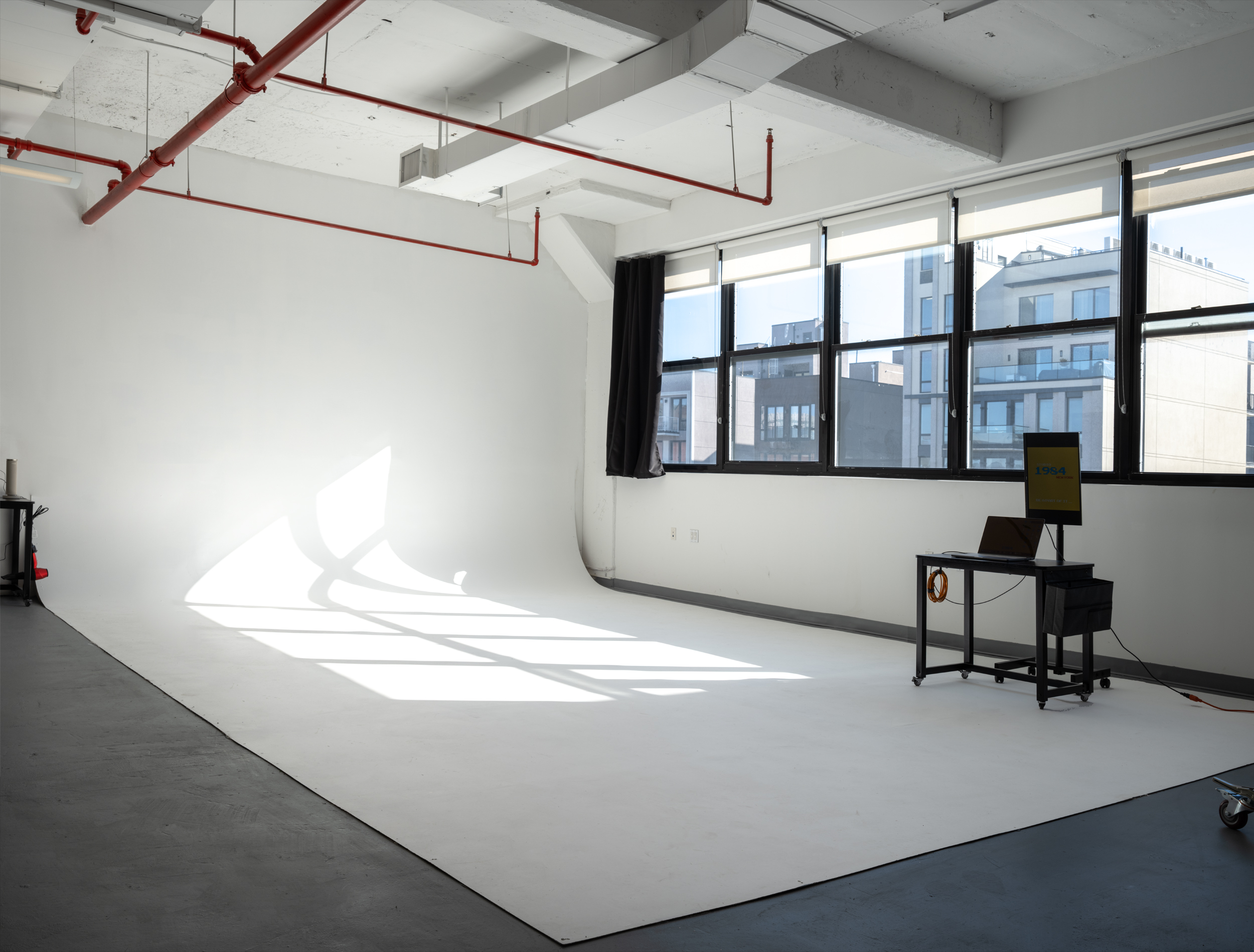 1984 Studio Brooklyn daylight photo studio with white cyclorama wall and natural light